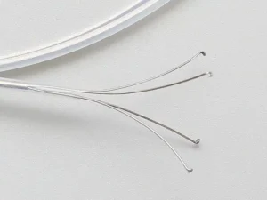 Clear curved wires on white background