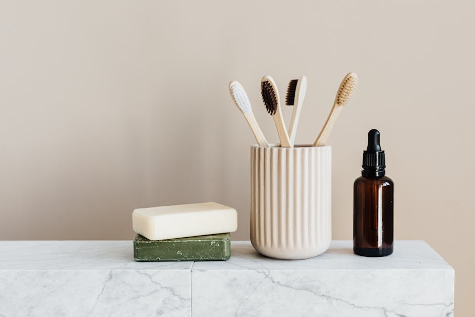 Eco-friendly bathroom accessories on marble countertop