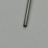 Close-up of a metal rod on textured gray background