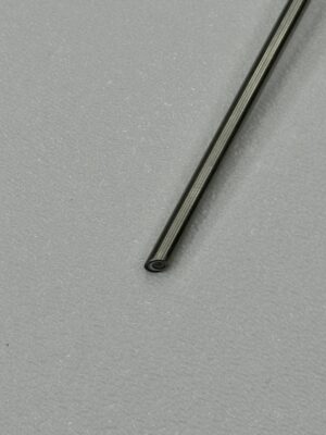 Close-up of a metal rod on textured surface