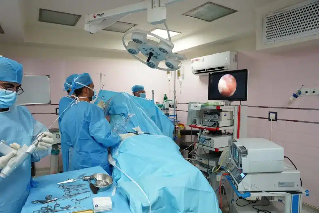 Surgeons performing operation in high-tech medical room