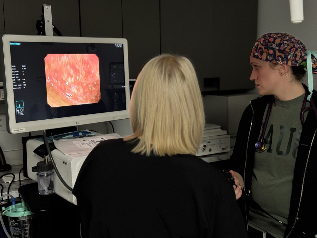 Medical professionals analyzing endoscopy image on monitor